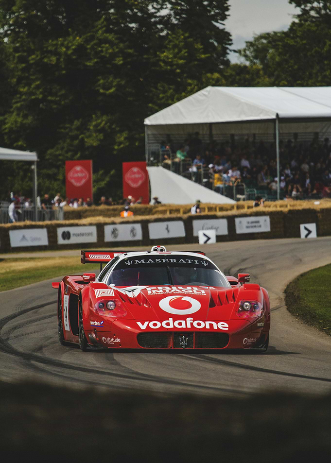 Red Maserati Race Car on Track