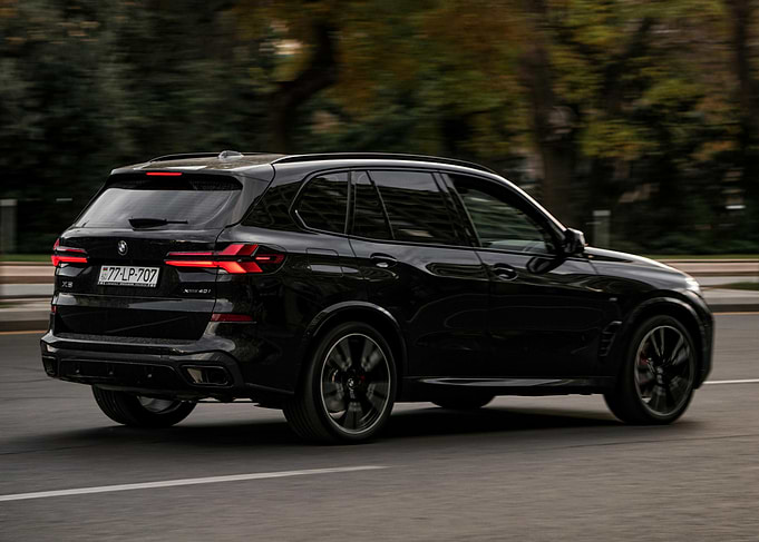 Black BMW X5 on the Road