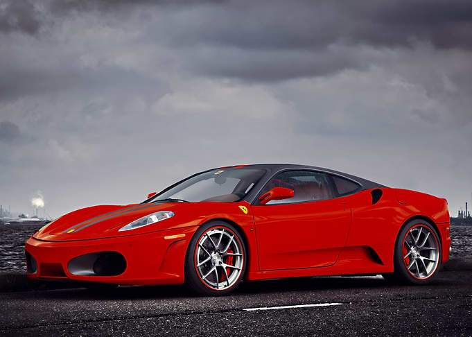 Red Ferrari on Asphalt Road
