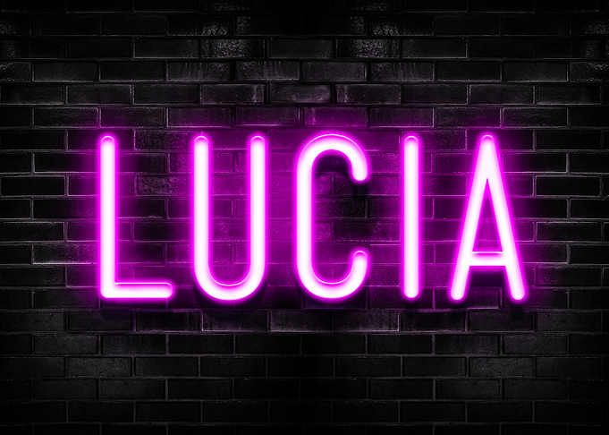 Lucia Neon Sign on Brick Wall