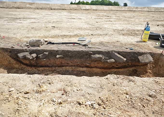 Archaeological excavation site with tools