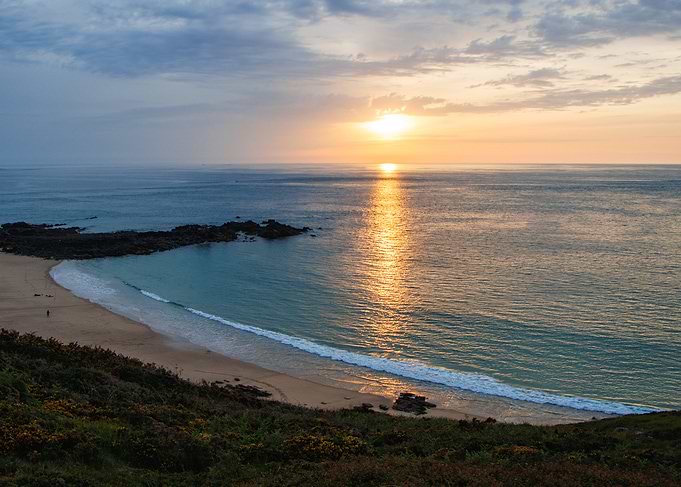 Sunset Over Tranquil Beach Cove