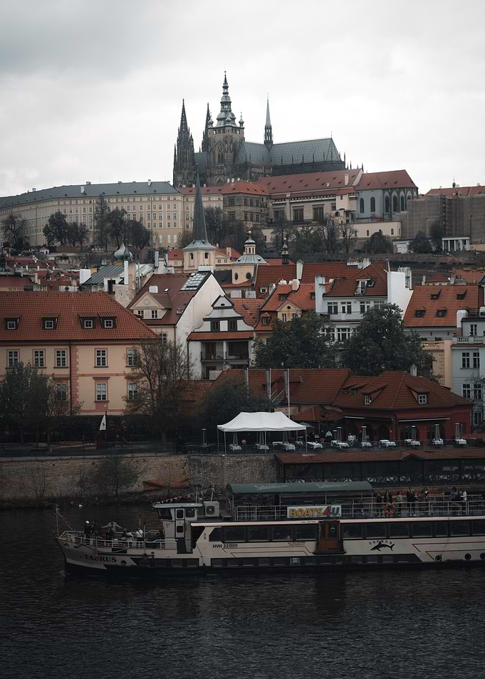 Prague cityscape with river and castle