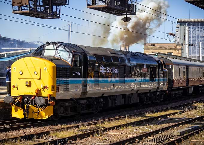 Class 37 locomotive powering out of Carlisle Station