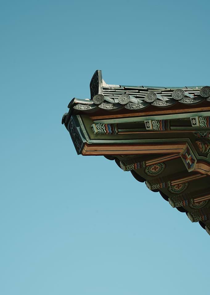 Korean Architecture Detail Against Blue Sky
