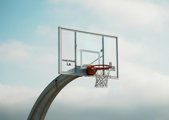 Basketball hoop against a cloudy sky