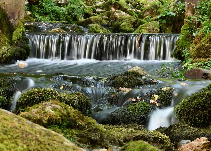 Mossy Waterfall in Lush Green Forest
