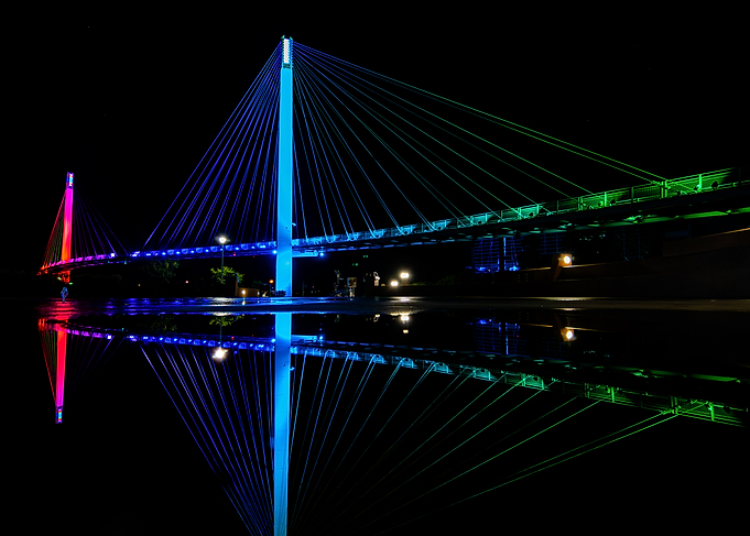 Colorful Bridge at Night with Reflection