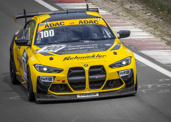 Yellow BMW Race Car on Track
