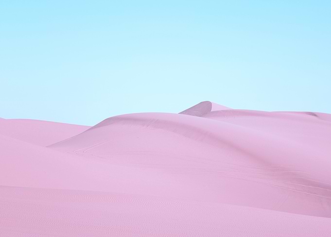 Pink Sand Dunes Under Blue Sky