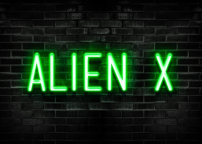 Alien X Neon Sign on Brick