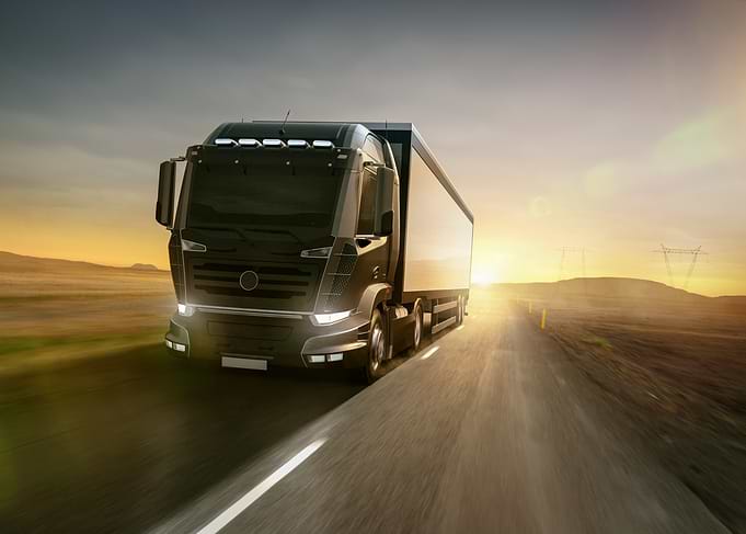 Truck on Road at Sunset