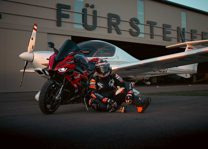 Motorcycle and Plane at Airport