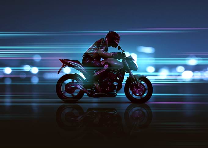 Motorcycle Speeding Through City Night