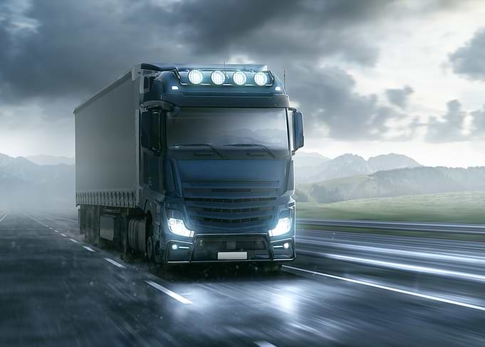 Blue Semi-Truck on Highway