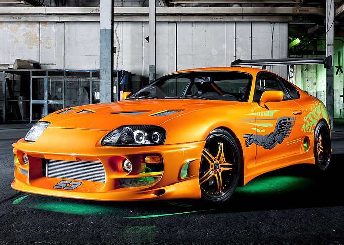 Orange Toyota Supra with Custom Graphics