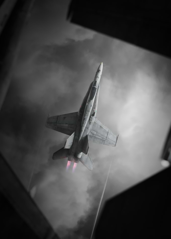 Fighter Jet Ascending Through Cloudy Sky