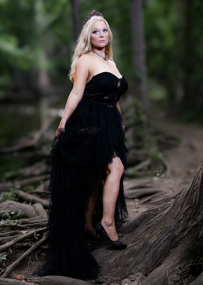 Woman in Black Dress in Forest