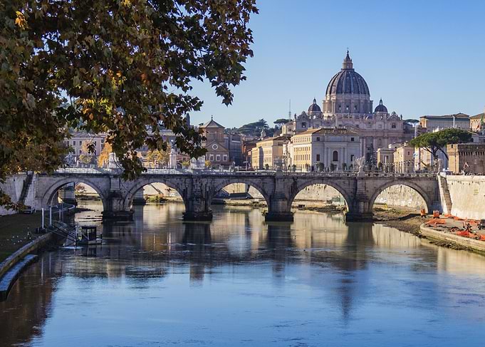 Rome cityscape with Ponte Sant'Angelo and St Peter basilica