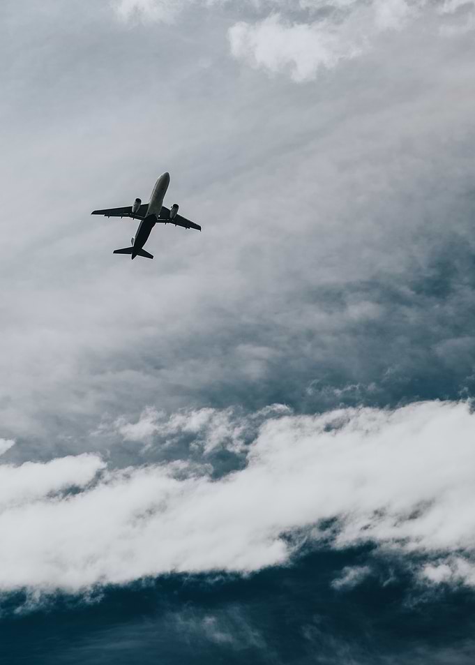 Airplane in Cloudy Sky