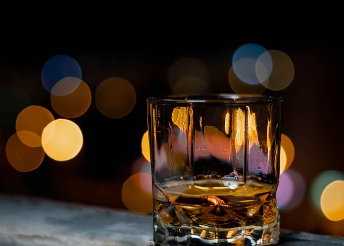 Whiskey glass with bokeh background
