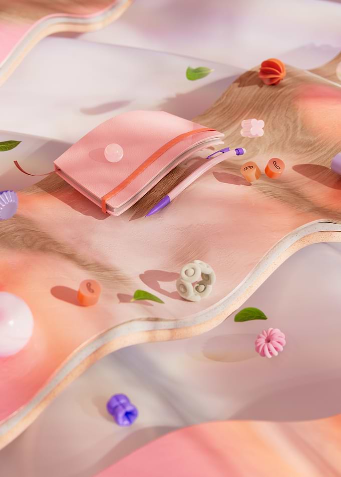 Pink notebook and colorful beads