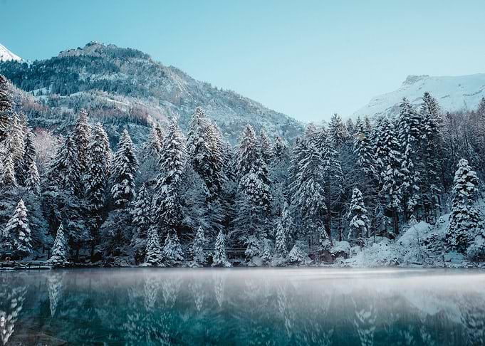 Winter landscape with lake and mountains