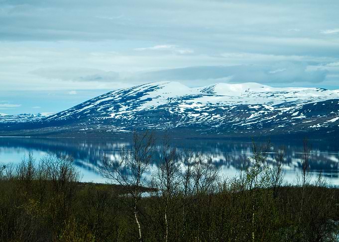Snowy Mountains Reflecting in Calm Lake