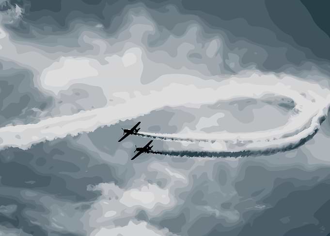 Planes in flight with smoke trails