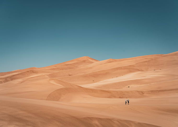 Desert landscape with two figures