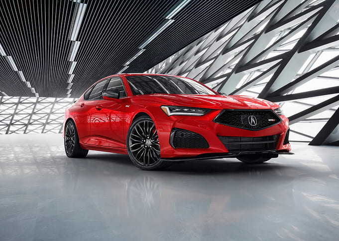 Red Acura TLX in Modern Setting