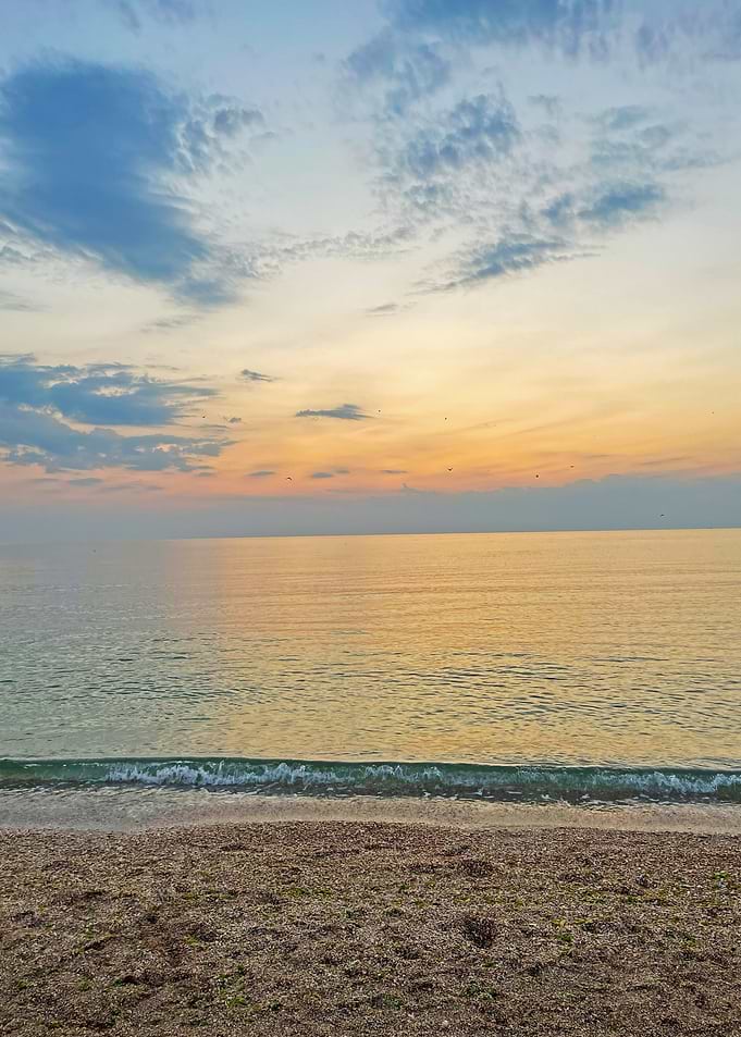 Calm beach at sunrise