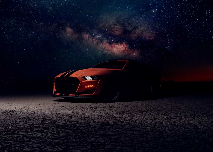 Orange Mustang under the Milky Way