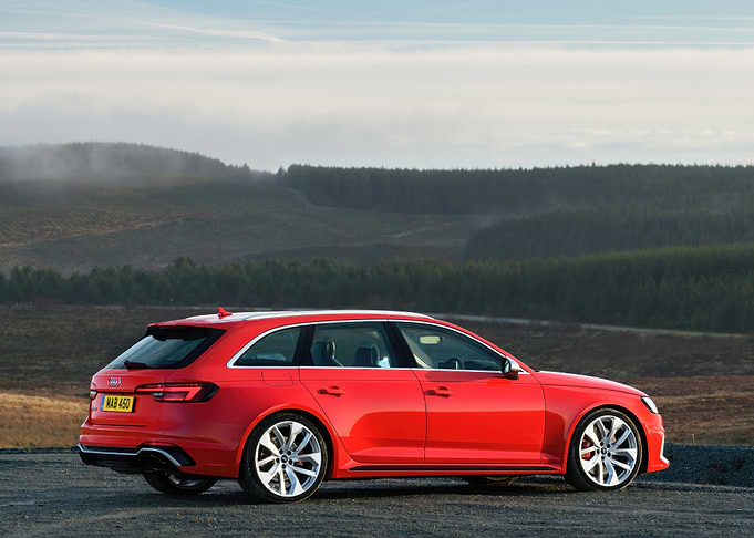 Red Audi RS4 Avant on Hillside