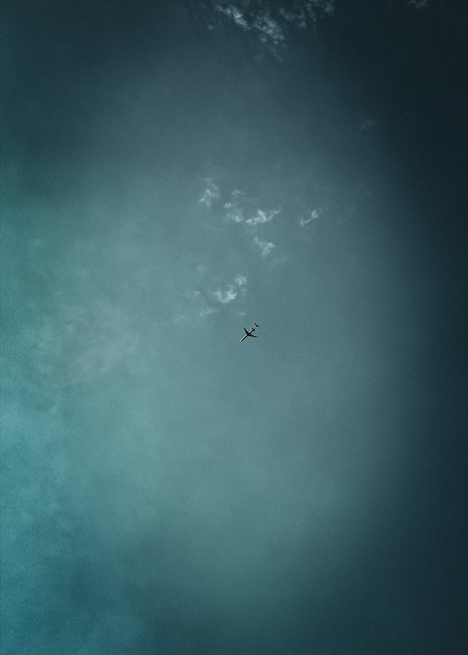 Airplane in a Cloudy Sky