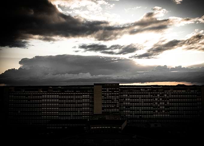 Building under dramatic cloudy sky