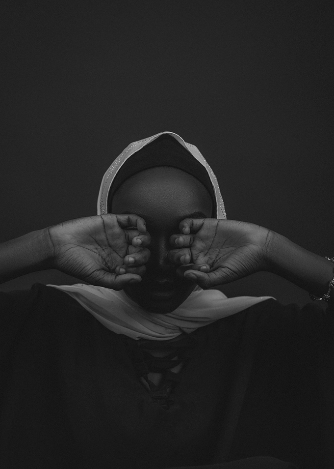 Monochrome Portrait with Hands Covering Eyes