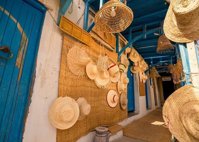 Traditional straw hats and crafts in a North African souk