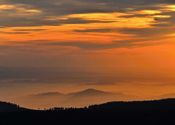 Orange Sunset Over Mountain Landscape