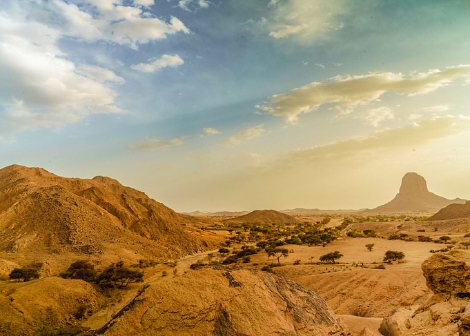 Desert Landscape with Mountains and Sky