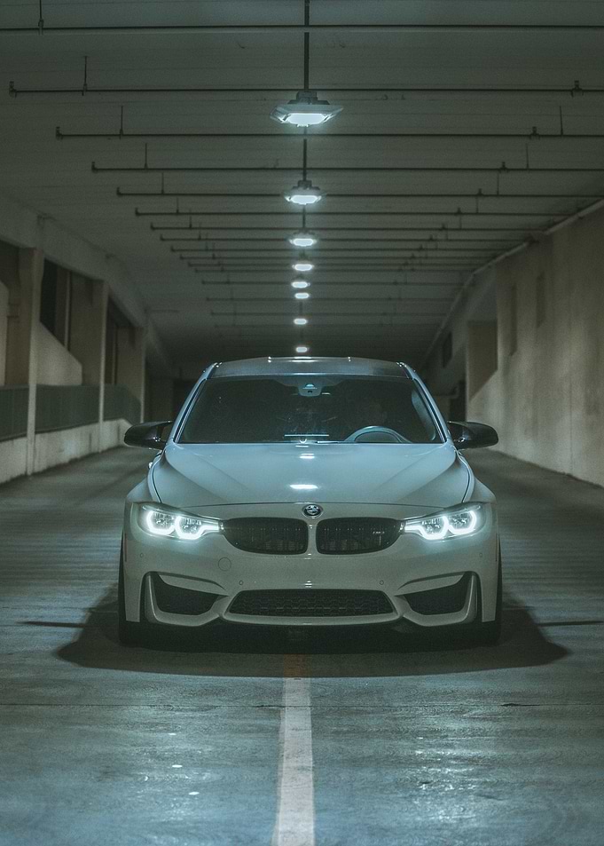 White BMW M3 in Parking Garage
