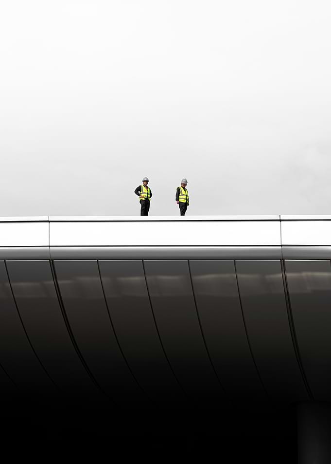 Two Workers on a Modern Chine Building