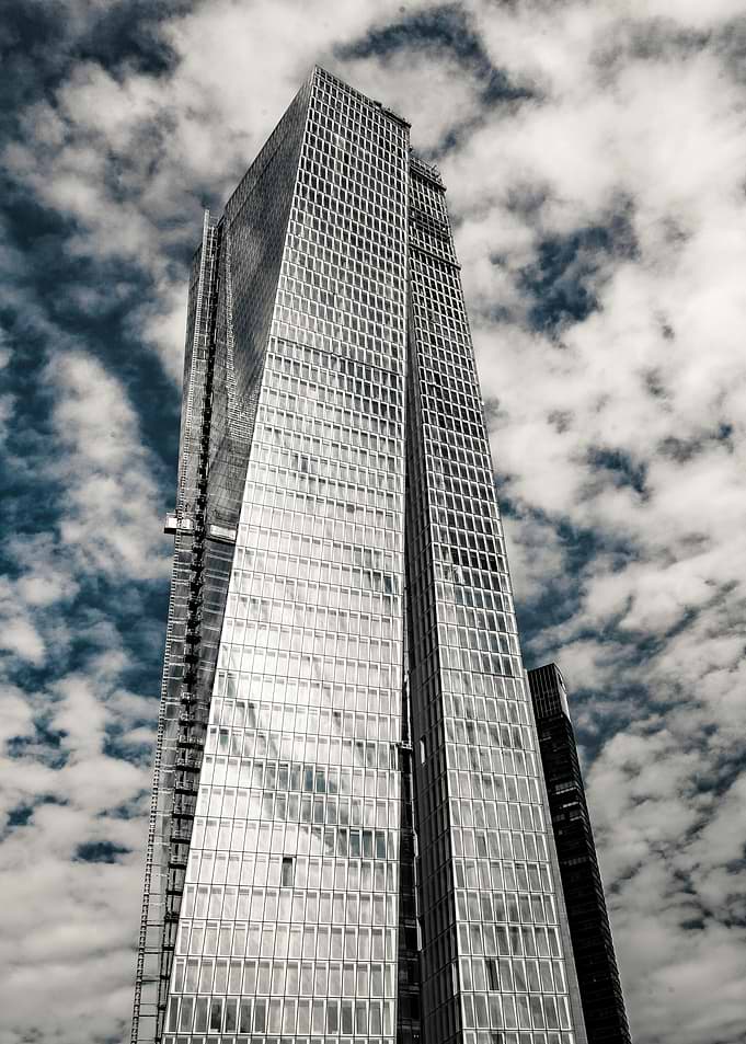 Modern Skyscraper Against Cloudy Sky