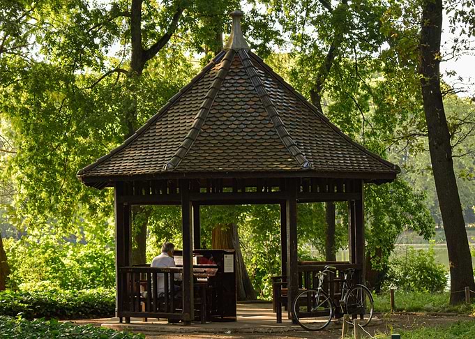 Gazebo with Piano and Bicycle in Park