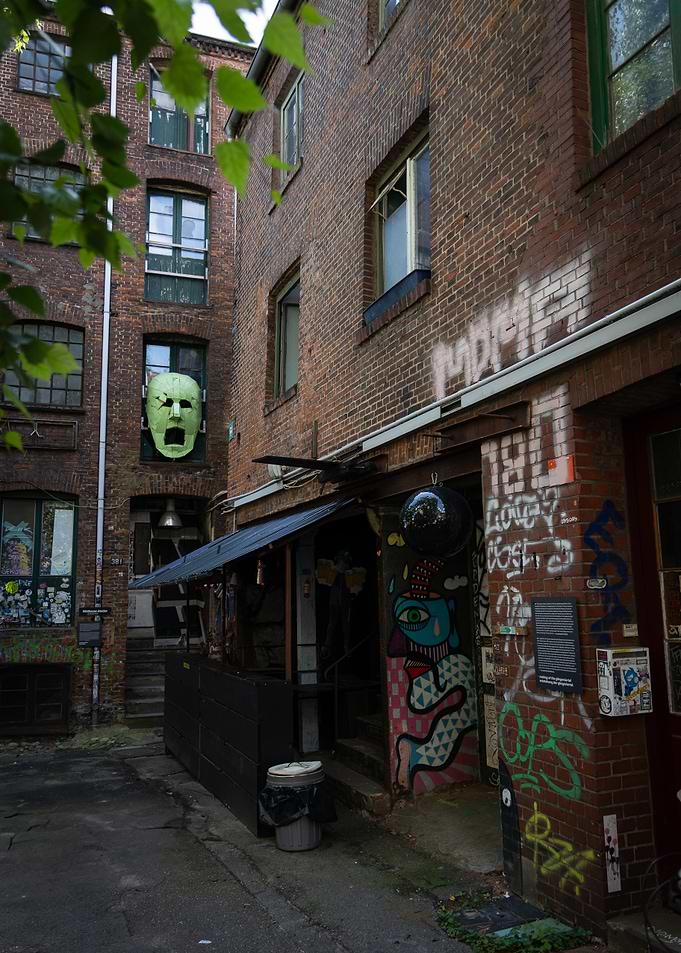 Urban Alleyway with Graffiti and Mask