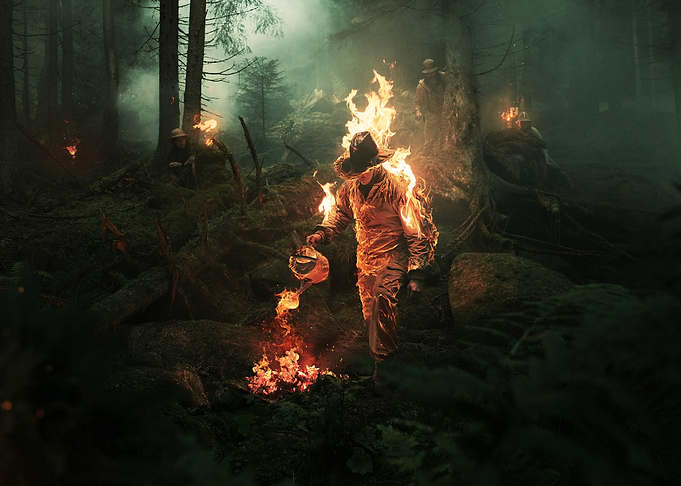 burning man in dark forest