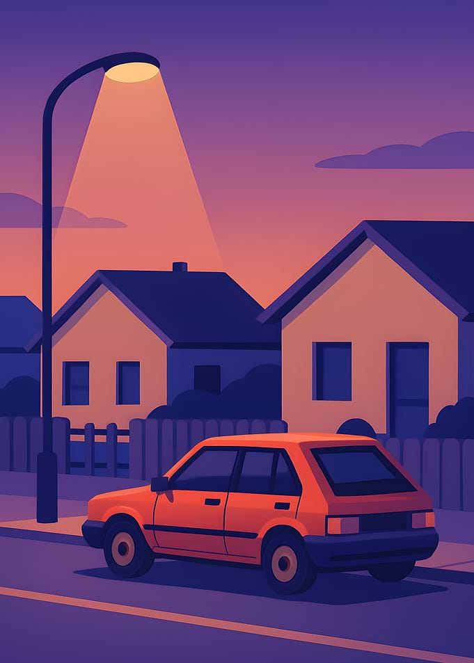 Orange Car Under Streetlight at Dusk
