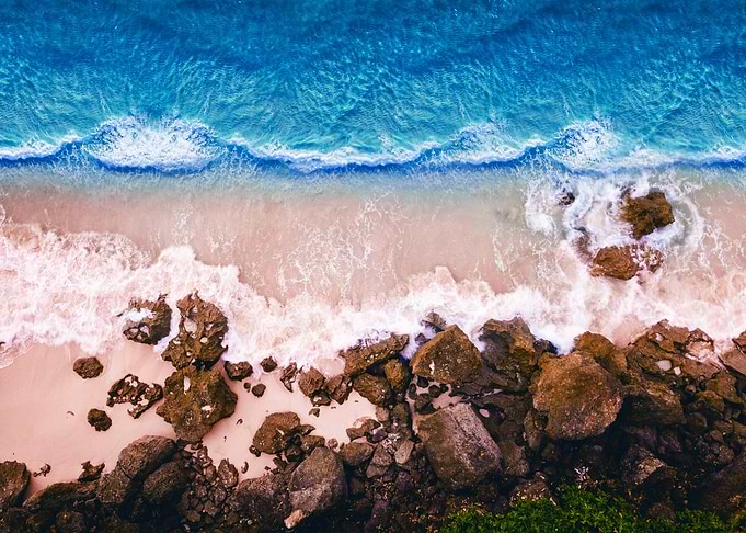 Aerial View of Ocean Waves Crashing