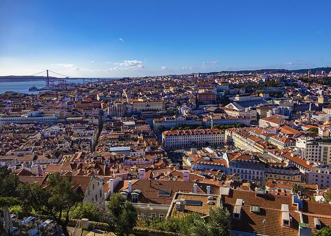 Lisbon cityscape with bridge and rooftops