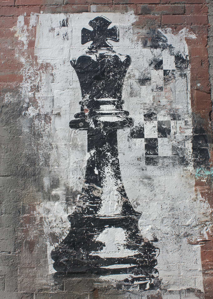 Chess King Graffiti on Brick Wall